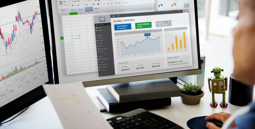 businessman-working-graph-spreadsheet-white-table (1)