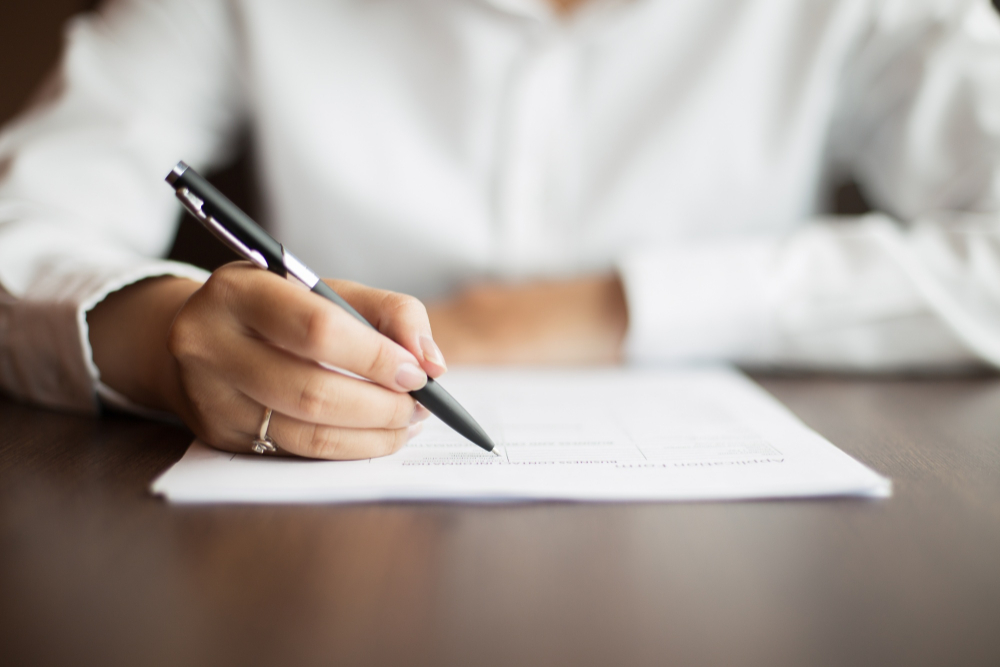 sitting-human-woman-workplace-paper
