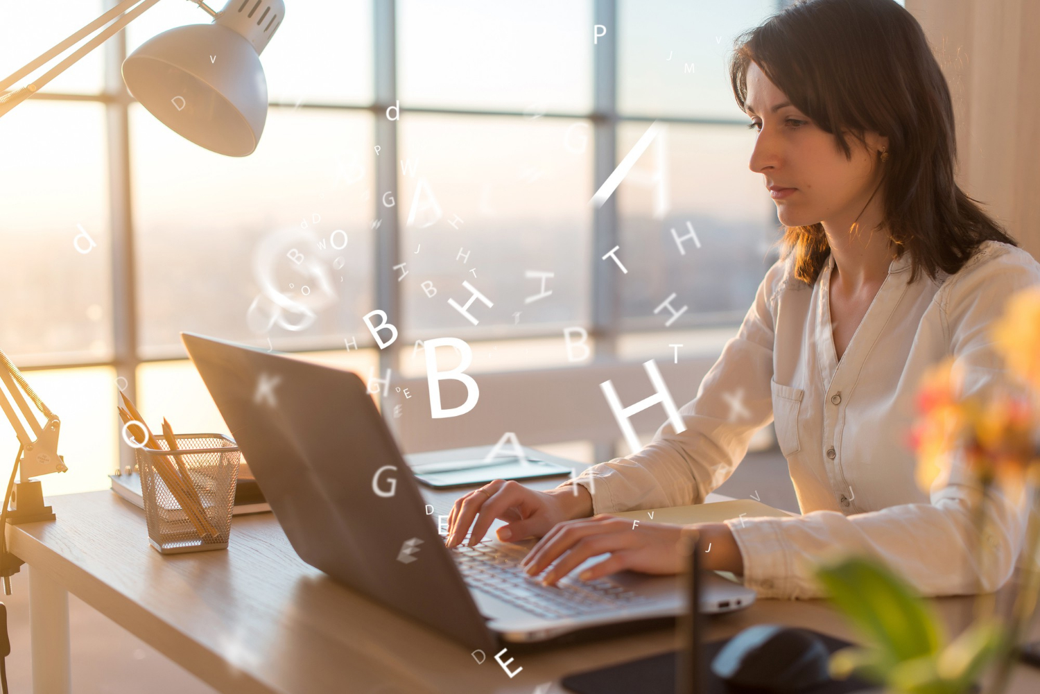 woman-at-workplace-using-laptop-working-typing-surfing-the-internet
