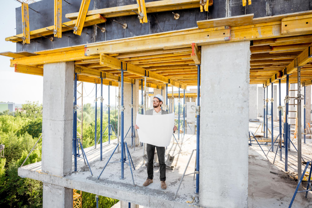 man-with-house-drawings-on-the-structure