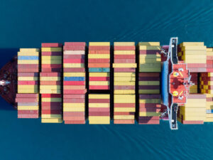 aerial-top-view-cargo-ship-carrying-container-running-export-goods-from-cargo-yard-port-custom-ocean-concept-technology-transportation-customs-clearance