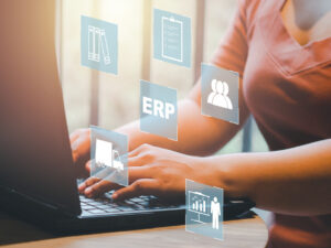 enterprise-resource-planning-erp-document-management-concept-icons-on-virtual-screen-hands-typing-on-computer-laptop-as-background