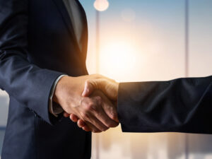business-agreement-and-successful-negotiation-concept-businessman-in-suit-shake-hand-with-customer