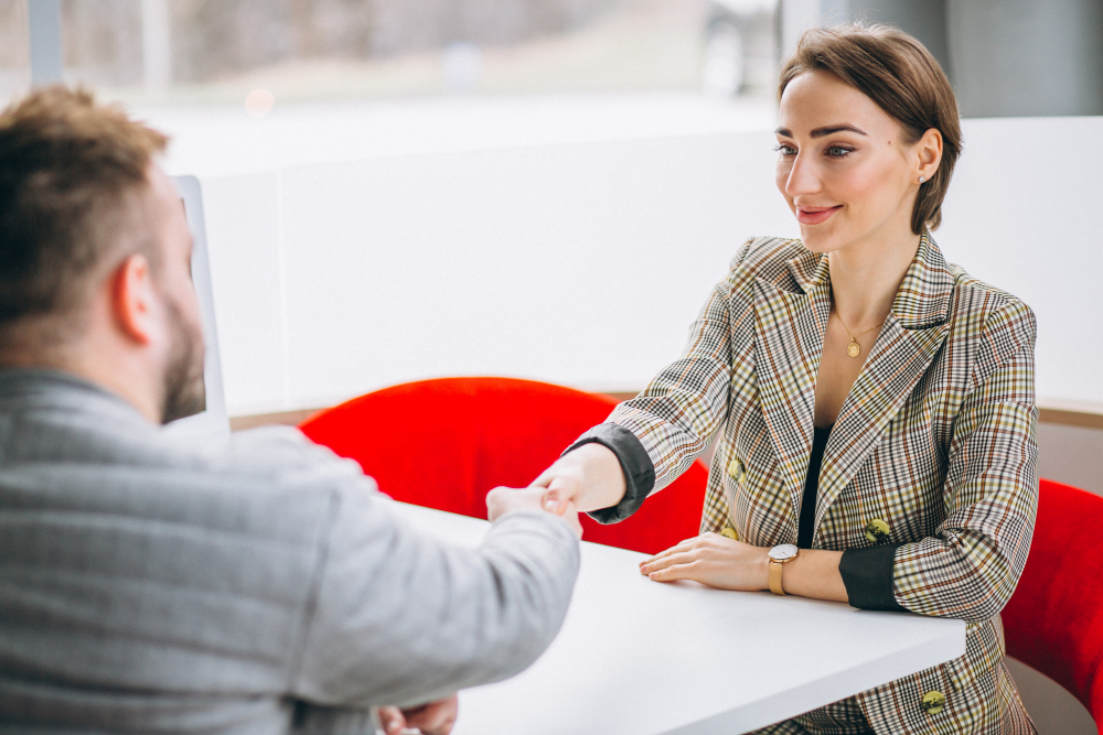 car-saleswoman-talking-with-client