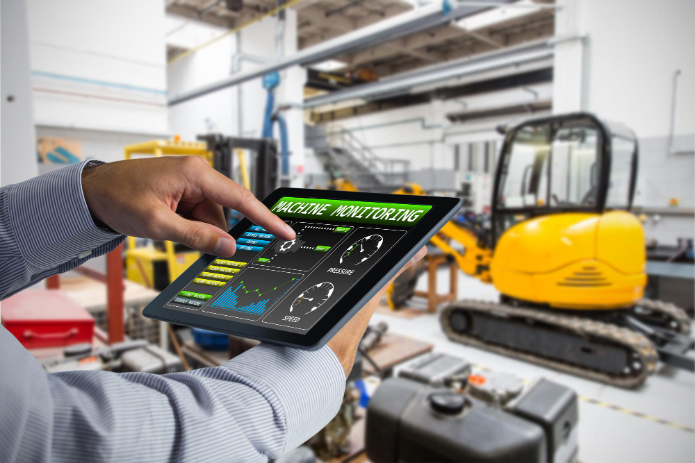 man-using-tablet-pc-against-industrial-equipments-in-factory