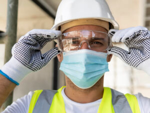 worker-wearing-safety-glasses-on-construction-site