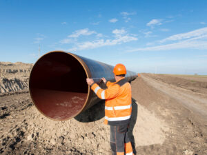 pipeline-workers-measuring-tube-length-for-construction-of-gas-and-oil-pipes