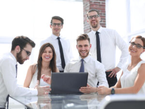 successful-business-team-at-the-desk-in-the-officethe-concept-of-teamwork