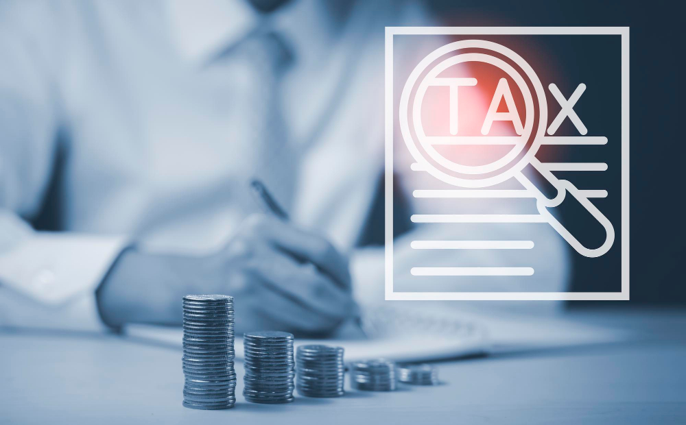 tax-stacked-coins-concept-businessman-write-book-note-modern-office-checking-balance-costs-startup-counting-finance-planning-strategy-brainstorming-income-tax-payment-concept