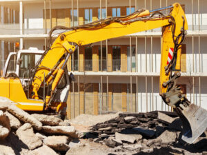 bulldozer-loading-concrete-waste-and-demolition-debris-for-recycling-at-construction-site