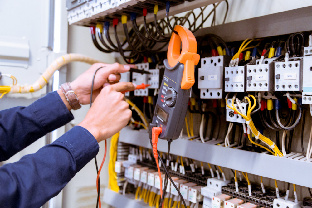 electrician-testing-electric-current-control-panel