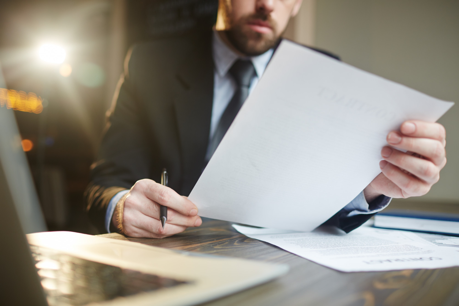businessman-working-with-documentation-at-desk