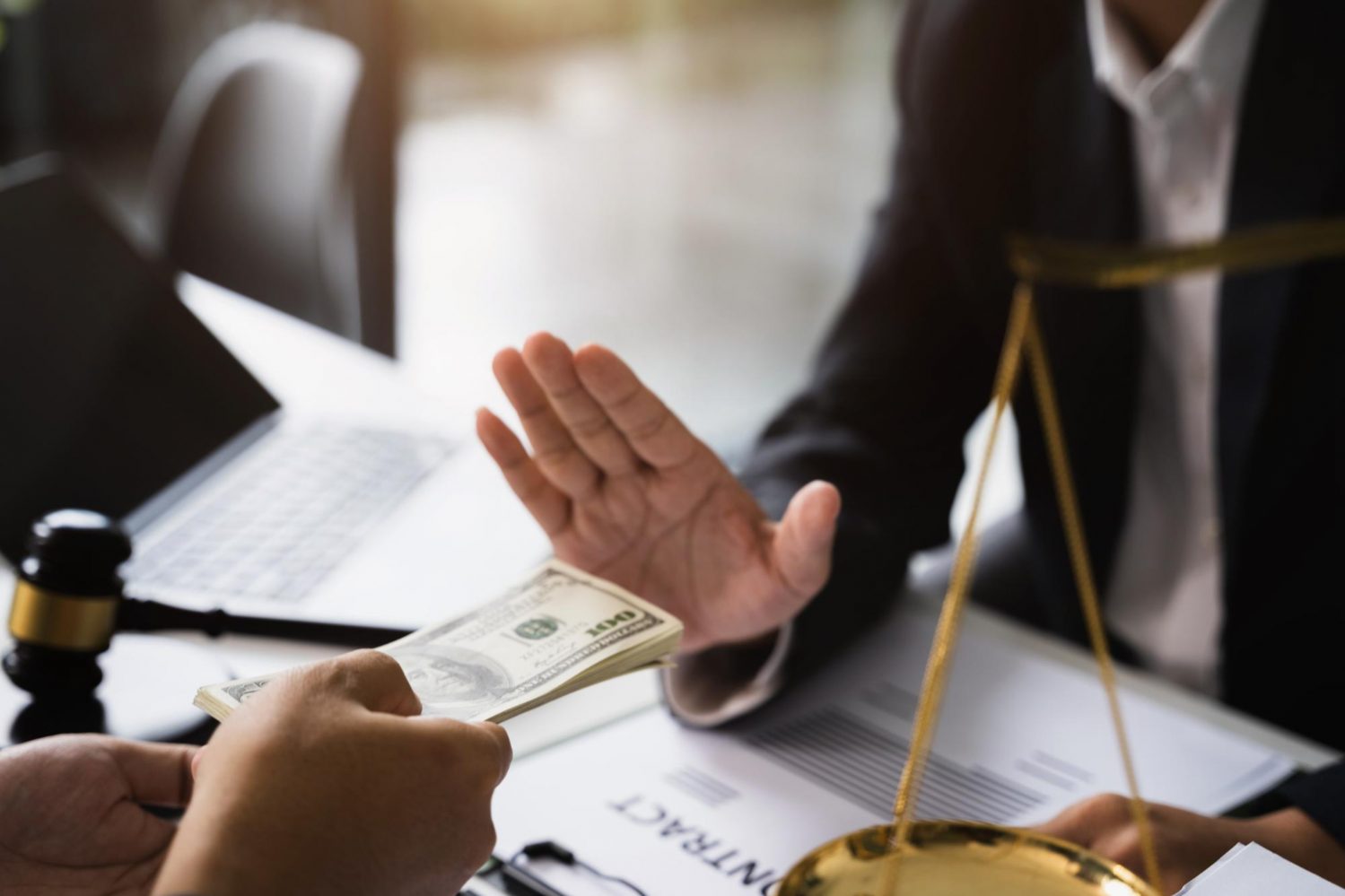 businessman-giving-bribe-money-in-the-envelope-to-partner